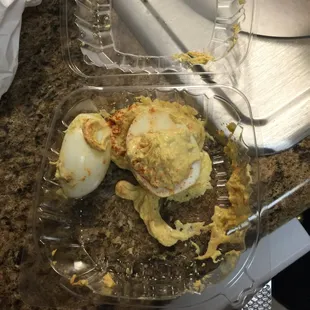 Ordered crab deviled eggs and when I open the container this is how they look! Did not taste a bit of crab either!