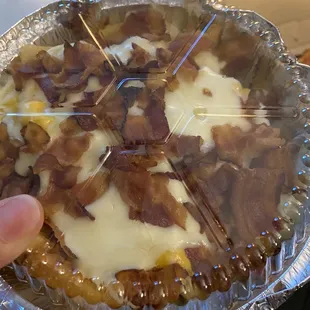 a pie with bacon and cheese