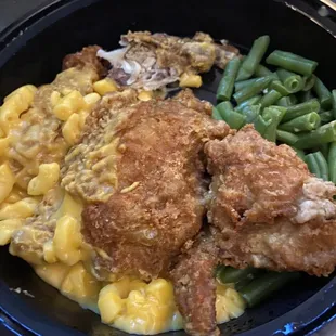 a plate of chicken and macaroni and cheese