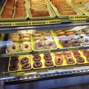 a display case full of different types of doughnuts