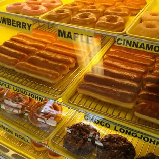 a variety of donuts in a display case