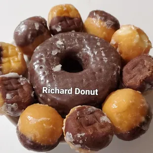 a variety of donuts arranged in a circle