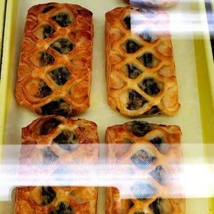 a variety of pastries in a display case