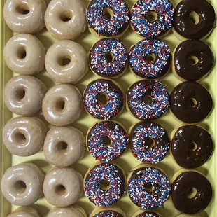 a tray of assorted donuts