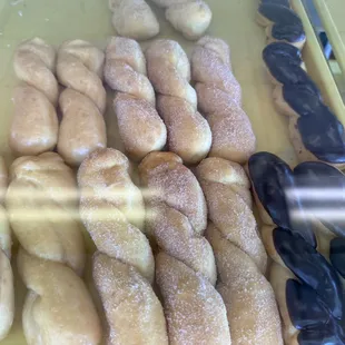 a variety of doughnuts in a display case