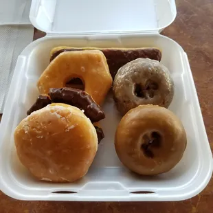 Chocolate cream filled long john, glazed, chocolate glazed olf fashioned, raspberry filled, blueberry cake, &amp; maple cake