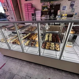 a display case filled with donuts
