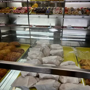 a variety of donuts in a display case