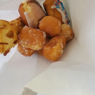 a box of donuts with sprinkles