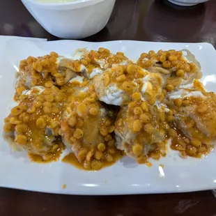 Masulli are filled with ground beef and topped with a seasoned yogurt sauce