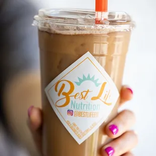 a person holding a cup of coffee