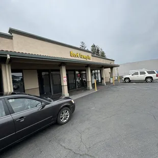 a car parked in front of a restaurant