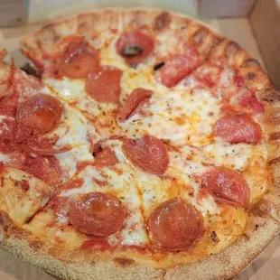 a pepperoni pizza in a box