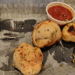 three pieces of bread and a small bowl of ketchup