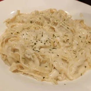 a white plate of pasta