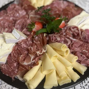 a platter of meat and cheese