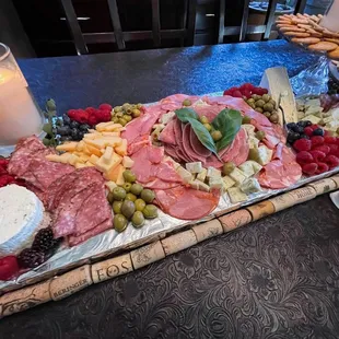 Three types of cheeses, I let them choose. Also three types of meats as well as berries... I added the rest!