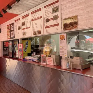 a restaurant counter with menus