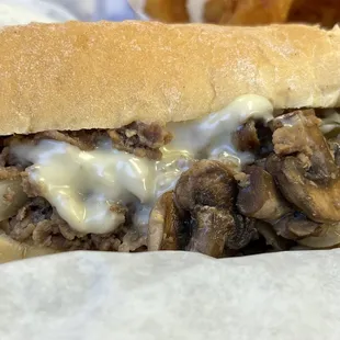 a sandwich with mushrooms and cheese