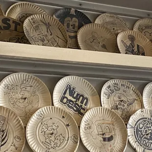 a shelf full of paper plates