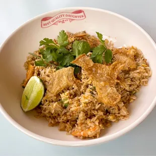 Dirty fried rice with crispy chicken skins, liver pate, pork, shrimp, and Creole seasoning