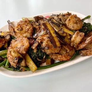 Shrimp in black bean sauce with rainbow carrots, smoked forest mushrooms, fermented black beans, and charred broccolini
