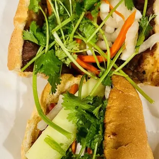 a sandwich with meat and vegetables