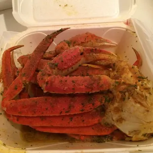 crab legs in a styrofoam container