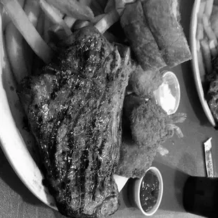 a plate of steak and french fries
