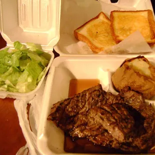 steak, bread, and salad