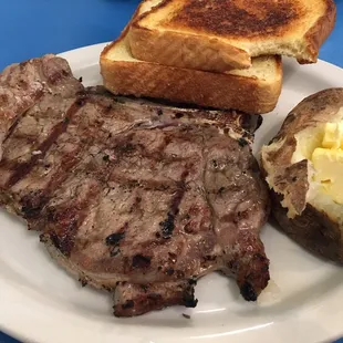 T-bone steak, medium well-done. Comes with a baked potato, buttered toast and salad.