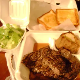 steak, bread, and salad