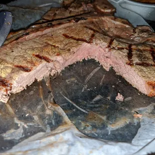 18 oz T-bone with 3 shrimps, baked potatoes, Texas bread and salad.