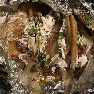 4 tacos wrapped together in foil