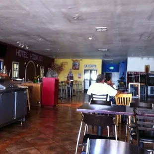 a man sitting at a table in a restaurant