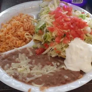 Green chicken enchiladas. Really good sauce and I absolutely love the rice.