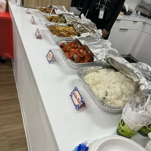 Rice, Kung pow chicken orange chicken, vegetarian tofu, and walnut prawns.