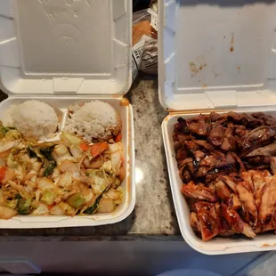 two take out containers of food