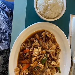 a bowl of rice and a bowl of chicken