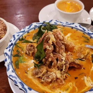 a bowl of soup and a bowl of rice