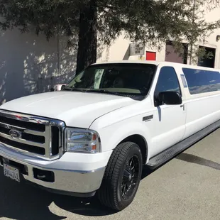 14 passengers Ford Excursion.