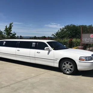 8 passengers Lincoln Town Car.