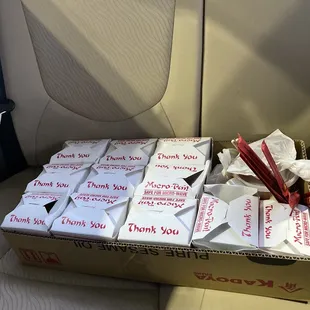 a box of food in the back seat of a car