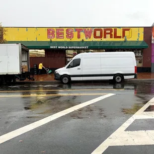 a white van parked in front of the store