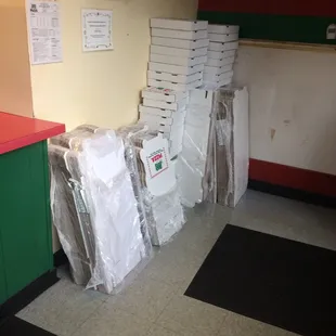 a stack of pizza boxes