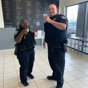 Sheriff&apos;s deputies having a nutritious donut hole energy shot!!