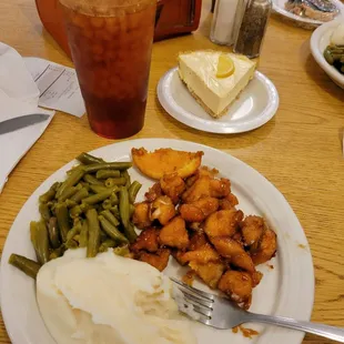 Orange chicken, green beans, Nash potatoes.