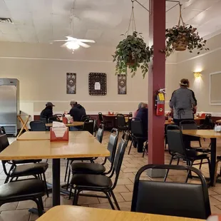 people sitting at tables in a restaurant