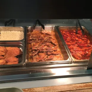 Part of the steam table lineup - BBQ Chicken, Pork Chops, Fish, &amp; Rice