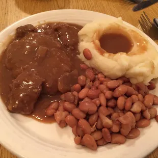 Country Style Steak, Mashed Potatoes, and Pintos.